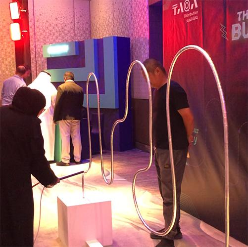 Giant Buzz Wire rental in Dubai with custom branding and wire shape for corporate events, brand activations, and carnival games in the UAE